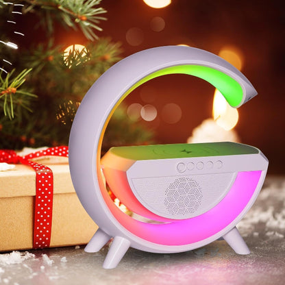 Colorful LED lamp with a Christmas tree and gift box in the background