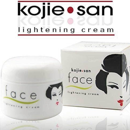 Kojie San lightening cream jar and packaging on a white background